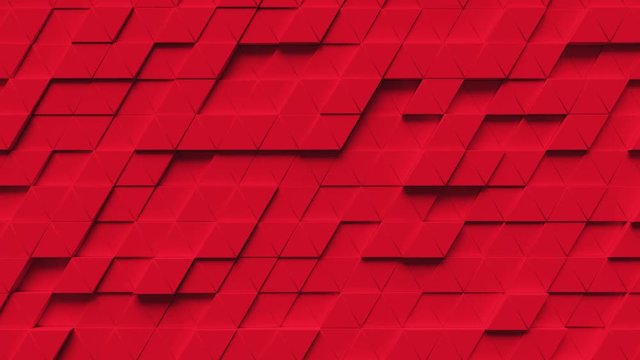 Abstract looping motion background texture of red triangles.