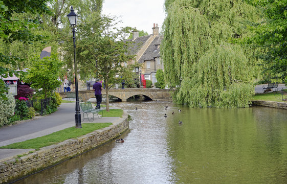 River Windrush wending its way through the quaint village of Bourton on the Water, Gloucestershire in the Cotswold region of England