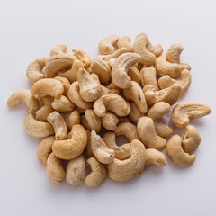 cashew nuts on a white acrylic background