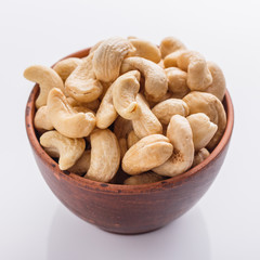 cashew nuts on a white acrylic background