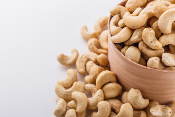 cashew nuts on a white acrylic background
