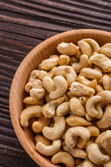 cashew nuts on a rustic wooden background