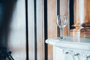 Empty wine glass in a beautiful interior