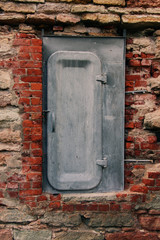 iron door in an old brick wall