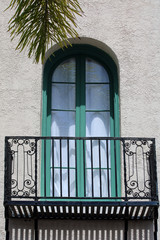 Obraz premium Balcony and Green Arched Window