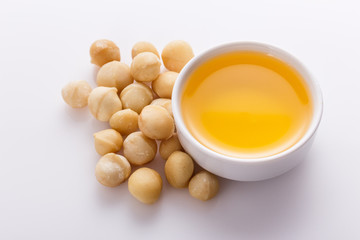 delicious macadamia nuts on a white acrylic background