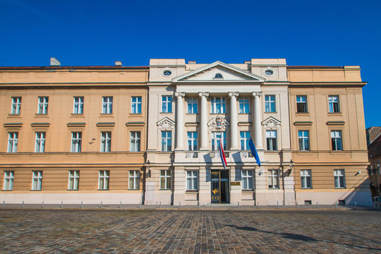 Palace building of Croatian Sabor parliament with flags of Craotia and European Union in Zagreb Croatia