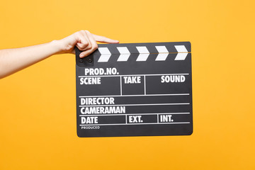 Close up female holding in hand classic director clear empty black film making clapperboard...