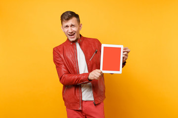 Portrait vogue fun young man in red leather jacket, t-shirt hold tablet pc pad with blank empty...