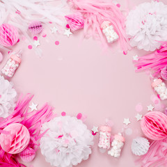 Frame made of Pink and white Paper Decorations for Baby shower party. It's a Girl. Flat lay, top view