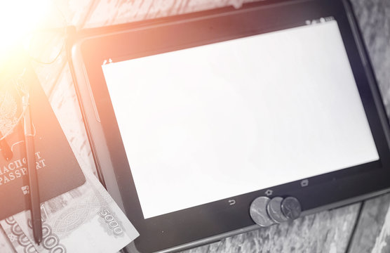 The graph of income growth. Electronic tablet with a graph of gr