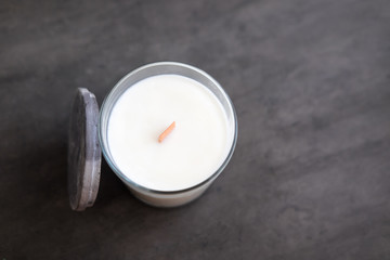 Concrete scented soy round candle on grey table