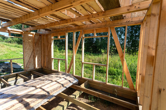 Construction of a new wooden house at the village