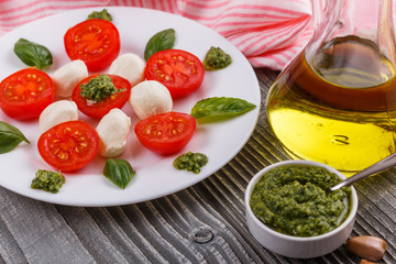 Caprese salad on a wooden rustic background