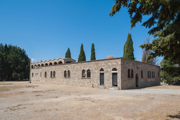 Fototapeta na wymiar Monastery of Filerimos, Rhodes Island, Greece. View from the west at modest stone masonry wall.