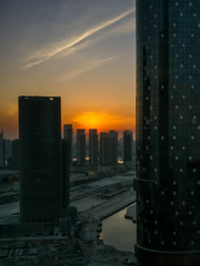 Top high view of Al Reem island towers and landscape during a beautiful sunset, UAE