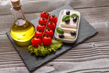 A piece of feta cheese on a wooden rustic background