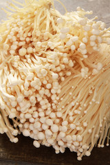 preparing fresh east asian enoki mushrooms