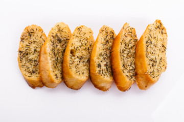 fragrant garlic bread on a white acrylic background