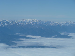 aerial view from plane mountains and clouds