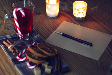 Christmas letter on the table with spices