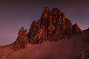 Awesome enrosadira effect at sunset on Dolomite mountain, South Tyrol, Italy