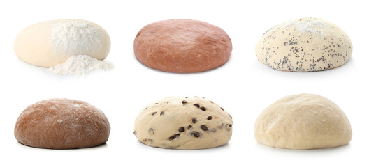 Set with different raw doughs on white background