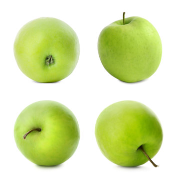 Set with delicious green apples on white background