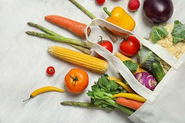 Flat lay composition with fresh vegetables on light background