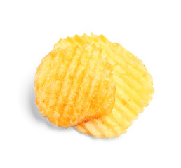 Tasty ridged potato chips on white background