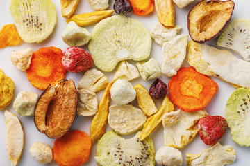 Aerial crispy snack from fruits and vegetables processed by vacuum drying, top view. Food background