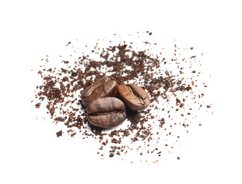 Coffee grounds and roasted beans on white background © New Africa