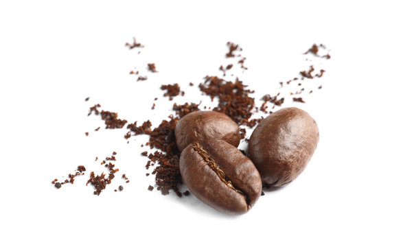 Coffee grounds and roasted beans on white background © New Africa