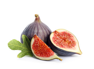Whole and cut purple figs on white background