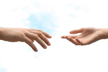 Man and woman giving each other hands on blurred background. Concept of support and help