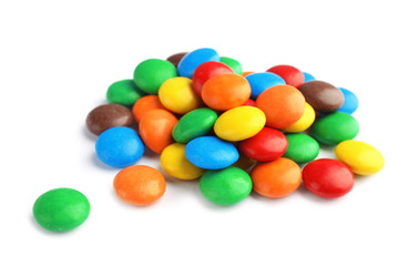 Pile of colorful candies on white background