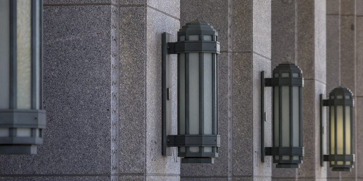 Columns with decorative wall lamps in a row