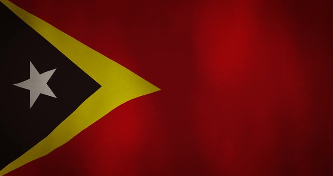 east timor flag fabric texture waving in the wind.