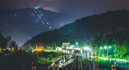 beautiful mountain railway leaving into the tunnel at night