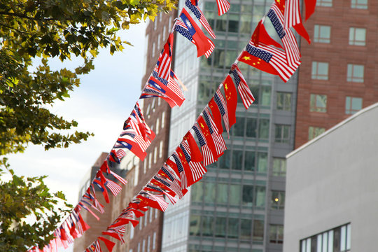 Celebrating National Days. 1 Oct is China’s National Day, 10 Oct is Taiwan’s National Day, Boston Chinatown hangs Chinese flags, Taiwanese flags and American flags celebrating holidays.