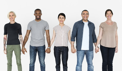 Happy diverse people holding hands together