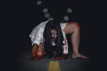 Portrait of asian woman make up ghost face with blood,Horror scene,Scary background,Halloween...