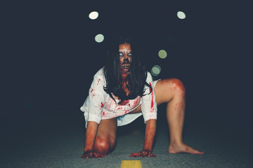 Portrait of asian woman make up ghost face with blood,Horror scene,Scary background,Halloween...