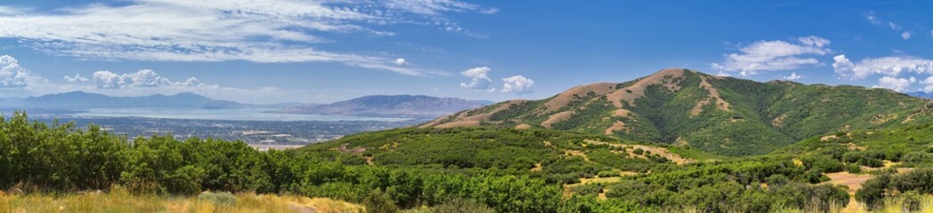 Panoramic Landscape view from Travers Mountain of Provo, Utah County, Utah Lake and Wasatch Front Rocky Mountains, and Cloudscape. Utah, USA. - obrazy, fototapety, plakaty