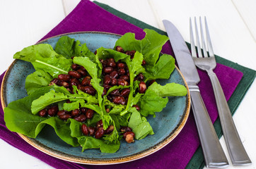 Vegetarian salad of red beans and arugula