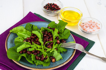 Vegetarian salad of red beans and arugula