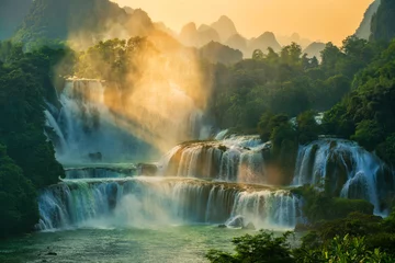 Rolgordijnen Bangioc - Detian waterfall is locate at border of China and Vietnam, It's famous water fall of both country. There are boat service tourist for see nearby the waterfall. © happystock