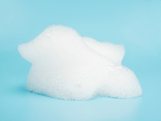 Soap foam bubble isolated on blue background object beatuy health care