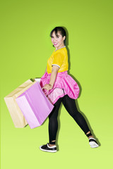 Pretty girl carrying shopping bags