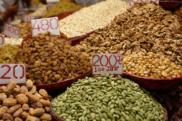 An assortment of fresh dried fruits, nuts, seeds and spices in the Khari Baoli spice market in Old Delhi, India.